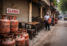 LPG Crisis Hits Mumbai Restaurants: 2,000 Shut, Industry Warns 50% May Close Soon Mumbai restaurant street with stacked LPG cylinders and closed eateries during a cooking gas supply crisis.