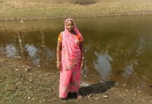 Water Conservation Brings Stability to Rural Lives in Rajasthan Woman standing near revived check dam in Banswara Rajasthan after water conservation work