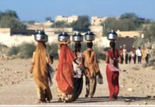 While Villages Struggle for Water, AI Data Centers Are Consuming Millions of Gallons Rural women carrying water pots in a drought-affected village landscape in India