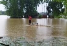 Assam Flood Death Toll Rises to 75; 3.32 Lakh Still Affected as Government Announces Relief Package Flood-affected residents in Assam as rescue teams continue relief operations after the death toll rose to 75.