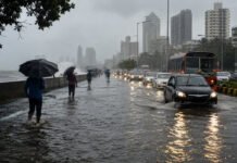Mumbai Rains: Schools, Colleges Shut, Andheri Subway Closed As Red Alert Triggers Flooding Across City Waterlogged road in Mumbai during heavy monsoon rain as schools remain closed under IMD Red Alert