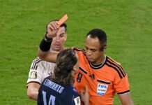 Red Cards on the Rise: Why FIFA World Cup 2026 Has Become Football’s Strictest Battleground in Years Referee shows a red card during a FIFA World Cup 2026 match as players react to the dismissal.