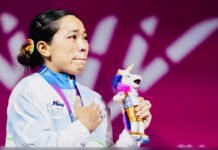 The Slice She Earned: How Mirabai Chanu Lifted More Than Gold in Glasgow Mirabai Chanu reacts emotionally after winning India’s first gold medal at the Glasgow 2026 Commonwealth Games.