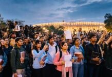 Generation Z’s Tremor at the Seat of Power A diverse group of young Indian students and professionals holding notebooks, documents and smartphones gather peacefully near Parliament while journalists document the event, symbolising Generation Z’s growing role in democratic participation.
