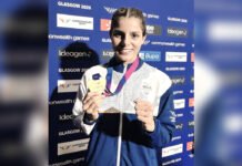 When the Anthem Kept Playing: India’s Golden Day in Glasgow Preeti Pawar displays her gold medal after winning the women's boxing title at the Glasgow 2026 Commonwealth Games.