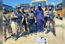Handwara Police Say Hizbul Mujahideen Module Busted, One Arrested With Pistol Security personnel with a man arrested during a joint operation in Handwara, with items police say were recovered displayed in front.